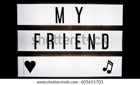My friend text in balck and white on light box sign board