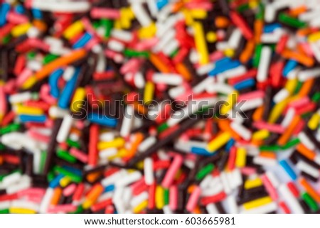 Sugar sprinkle dots, decoration for cake and bekery, a lot of sprinkles as a background. blur