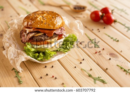 Burgers with juicy roasted beef, lettuce, tomato slices, cheese and avocado