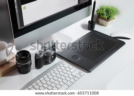  Graphic designer tools digitizer or Graphic tablet at workplace desk in creative office.