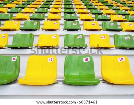 Yellow and Green Seat Pattern in Football Stadium