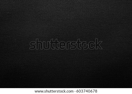 Black fabric texture background. Detail of canvas textile material. Royalty-Free Stock Photo #603740678
