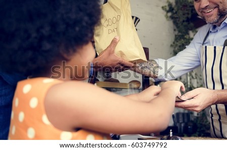 Customer buying bread at bake shop