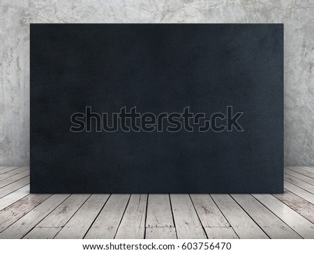 Blank long black fabric canvas frame leaning at concrete wall on wooden plank floor in perspective room,Business mock up presentation design