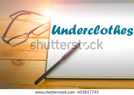 Underclothes  - Abstract hand writing word to represent the meaning of word as concept. The word Underclothes is a part of Action Vocabulary Words in stock photo. Royalty-Free Stock Photo #603817745