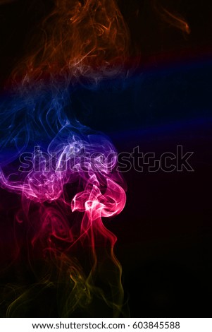 Colored smoke on black background. abstract art