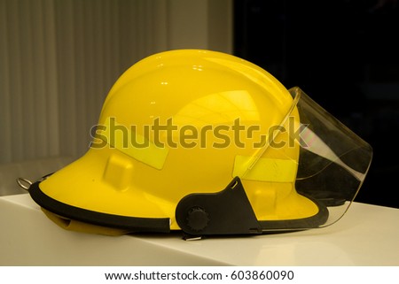 Firefighters in yellow fire-proof uniform.