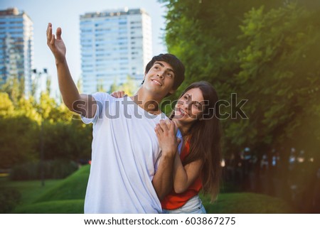 portrait of happy Hispanic couple in the park