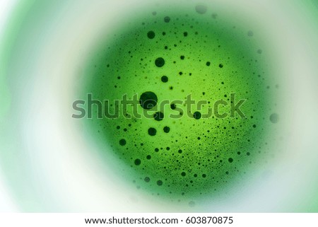 top view of beer bubbles in bottle