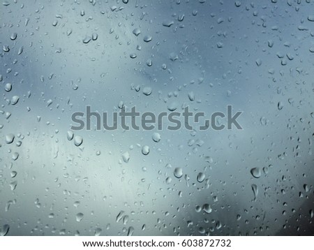 Rain drops on window glass On a dark day, the atmosphere is tarnished.