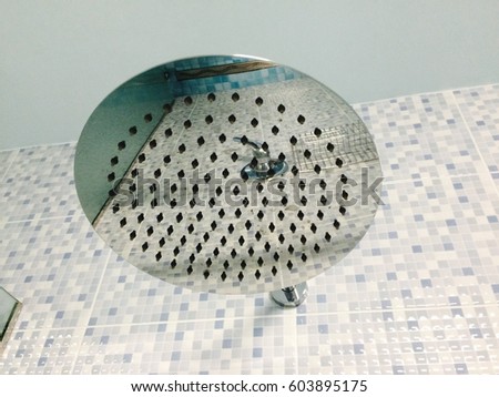 Chrome shower head.
