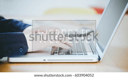 Webseite, German text for Website, text over young business man typing on laptop at desk in office environment