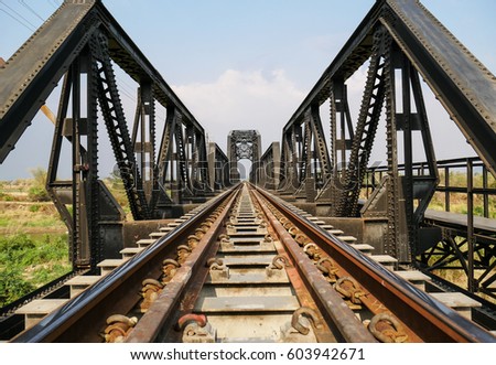 Steel structure of railway bridge, railway rail with vanishing point, amazing perspective