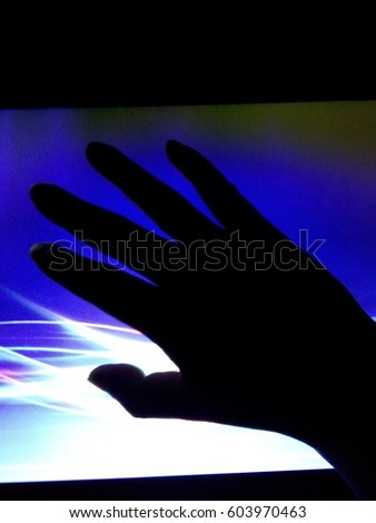 dark hand touching light