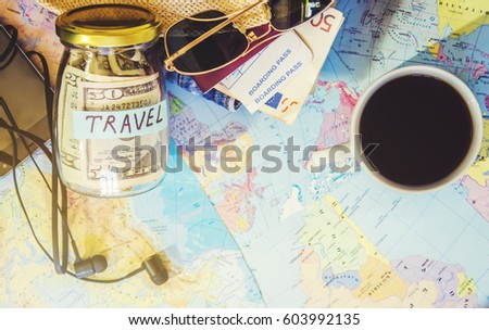 Background the journey, the reflection in the Cup of coffee. Map. Selective focus. 