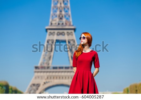 beautiful young woman on the Eiffel Tower background, Paris, France