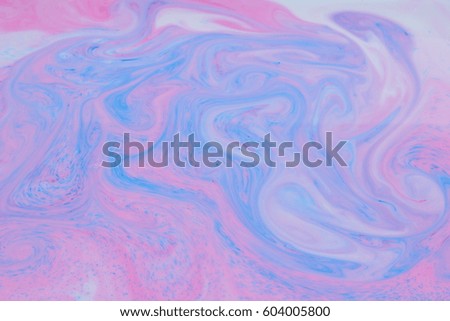 Fluid Art background. Abstract background with paints on liquid. Multicolored pattern in bright colors
