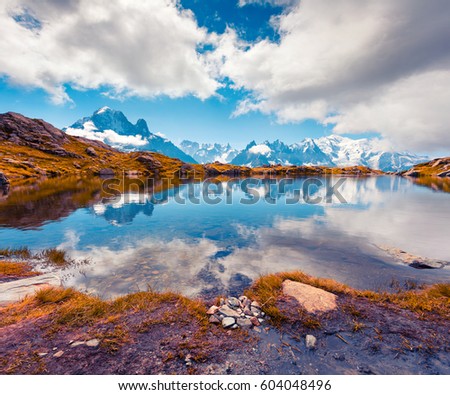 Colorful autumn view of the Lac Blanc lake with Mont Blanc (Monte Bianco) on background, Chamonix location. Beautiful outdoor scene in Vallon de Berard Nature Preserve, Graian Alps, France, Europe. 