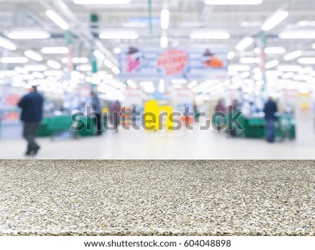 Marble board empty table in front of blurred background. Perspective marble over blur in supermarket - can be used for display or montage your products. Mock up for display of product.