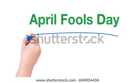 April fools day word write on white background by woman hand holding highlighter pen