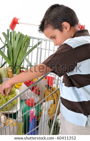 Cute boy with shopping cart full of grocery isolated on white background - a series of SHOPPING TROLLEY images.