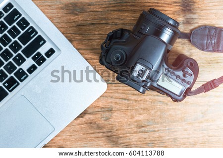 Photographer journalist camera photo on wooden table. Freelance designer photography concept