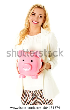 Young woman with piggy bank
