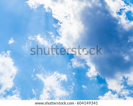 The bright sky with cloud and the sunshine with sun ray.The cloud can imagine in some kind of animal