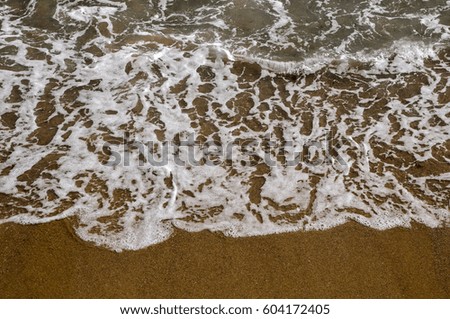 Wave on sandy beach