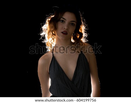 Pretty young model woman posing in studio
