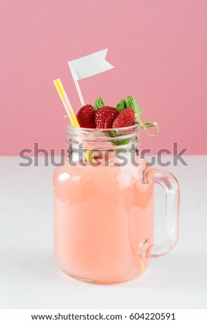 glass jug handle cocktail mocktail alcohol drink fresh raspberry mint white flag straw drink isolated pink background