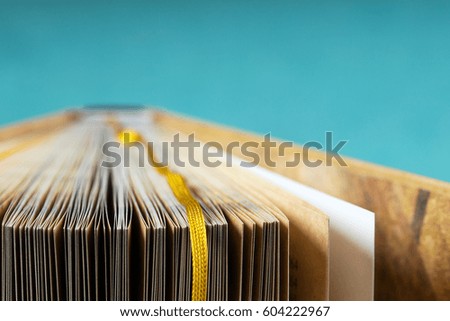Book on a blue background. Back to school. Copy space. Top view.