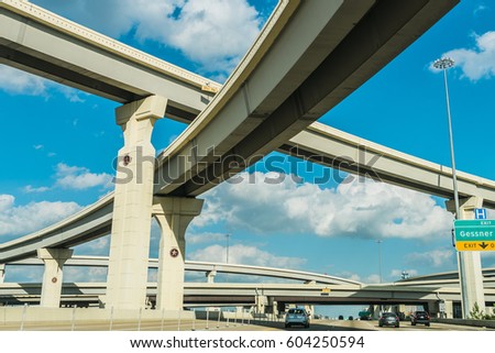 A view of freeway system in Houston TX, USA at i10 Katy freeway and Gessner Rd Royalty-Free Stock Photo #604250594