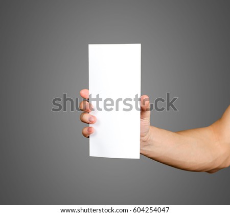 Hand holding blank brochure booklet in the hand. Leaflet presentation. Pamphlet hand man. Man show offset paper. Sheet template. Book in hands. Booklet folding design. Fold paper sheet display read.