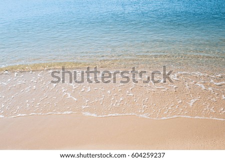 beautiful wave of sea on the sand beach
