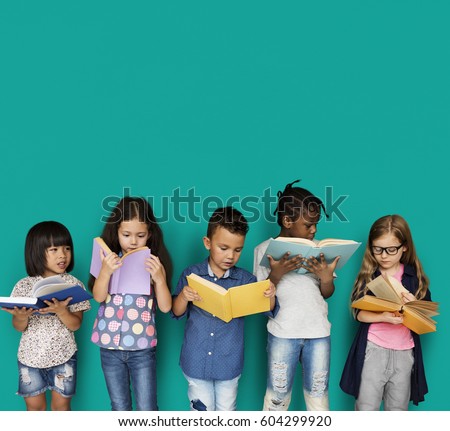 Diverse Group Of Kids Study Read Book Royalty-Free Stock Photo #604299920