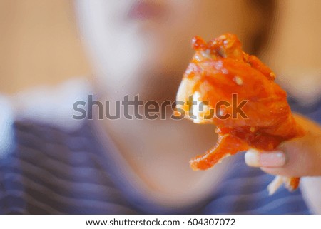 Picture blurred abstract background of fat woman eat grill chicken