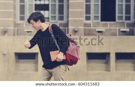 Young student college hurry late for class Royalty-Free Stock Photo #604311683