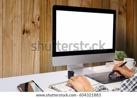 Graphic designer using digitizer or Graphic tablet at his desk with Modern desktop computer. Blank screen Monitor for Graphic design montage.