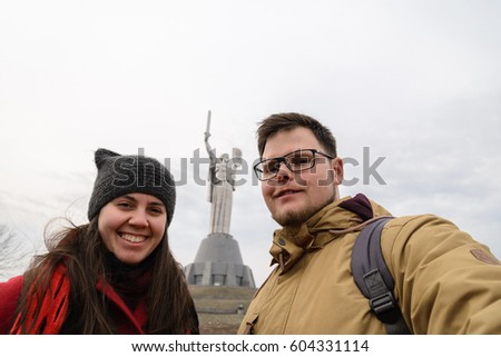 Mother Motherland monument - couple takes selfie in front of statue