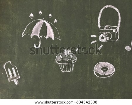 Umbrella,cake ,camera ,ice cream,donut drawn in cartoon style on black broad,it is texture on board in coffee shop.