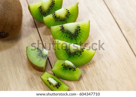 Close up of Healthy food. Whole and sliced kiwi. Kiwi fruit.
