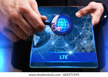 Business, Technology, Internet and network concept. Young businessman working on a virtual screen of the future and sees the inscription: LTE