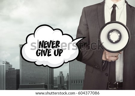 Never give up text on speech bubble with businessman