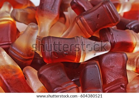 Cola gum candy. Gummy candy cola flavored sweet snack. Cola bottle shaped sweets.
