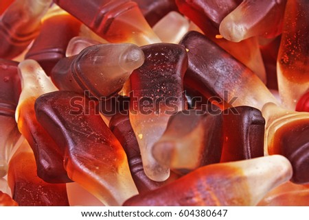 Cola gum candy. Gummy candy cola flavored sweet snack. Cola bottle shaped sweets.
