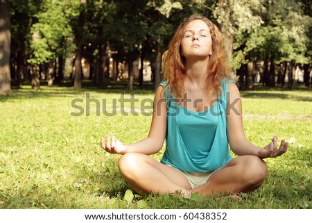 Woman meditation in grass
