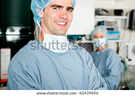 A portrait of a surgeon in a small operating room