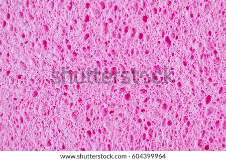 Pink sponge texture background, closeup.