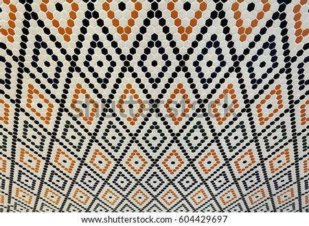 Warped hexagonal mosaic wall tiles.
